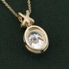 Oval Cut Moissanite Halo Pendant Necklace with Criss Cross Accents (29)