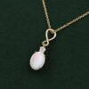Oval cut natural opal infinity pendant necklace with diamond accents