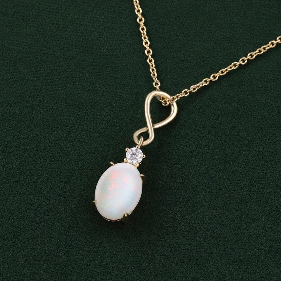 Oval cut natural opal infinity pendant necklace with diamond accents