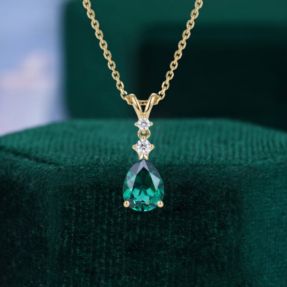 Pear Cut Emerald Three Stone Pendant Necklace with Diamond Accents
