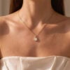 Round Cut Moissanite Infinity Pendant Necklace With Leaf Accents (1)