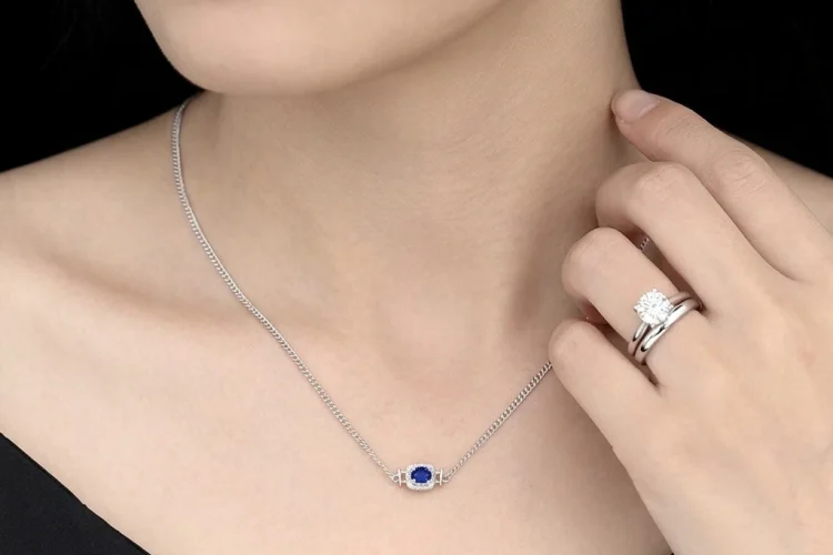 Oval cut lab-grown sapphire necklace matching an engagement ring